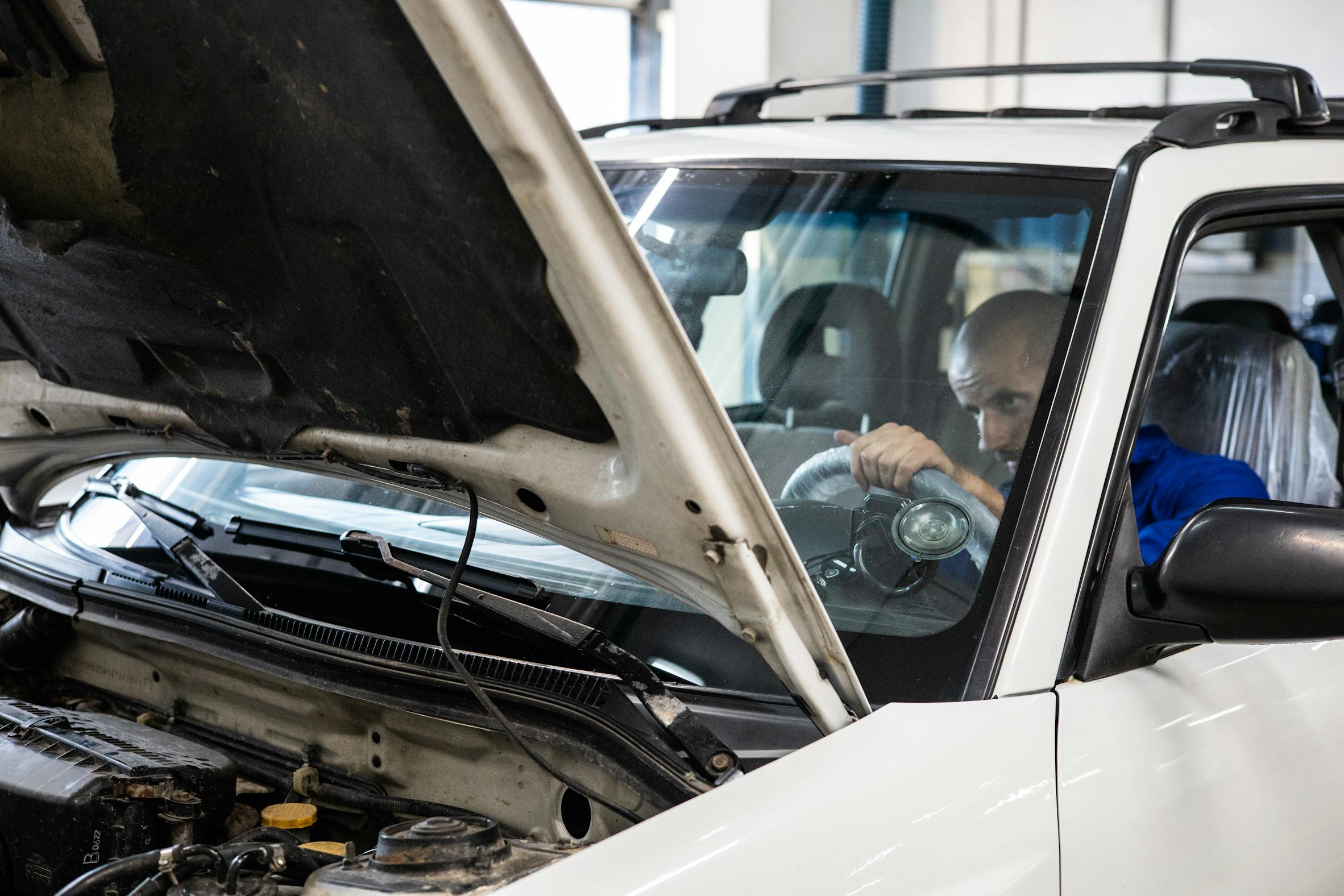 Mechanic working on a vehicle at Oak City Auto in Raleigh