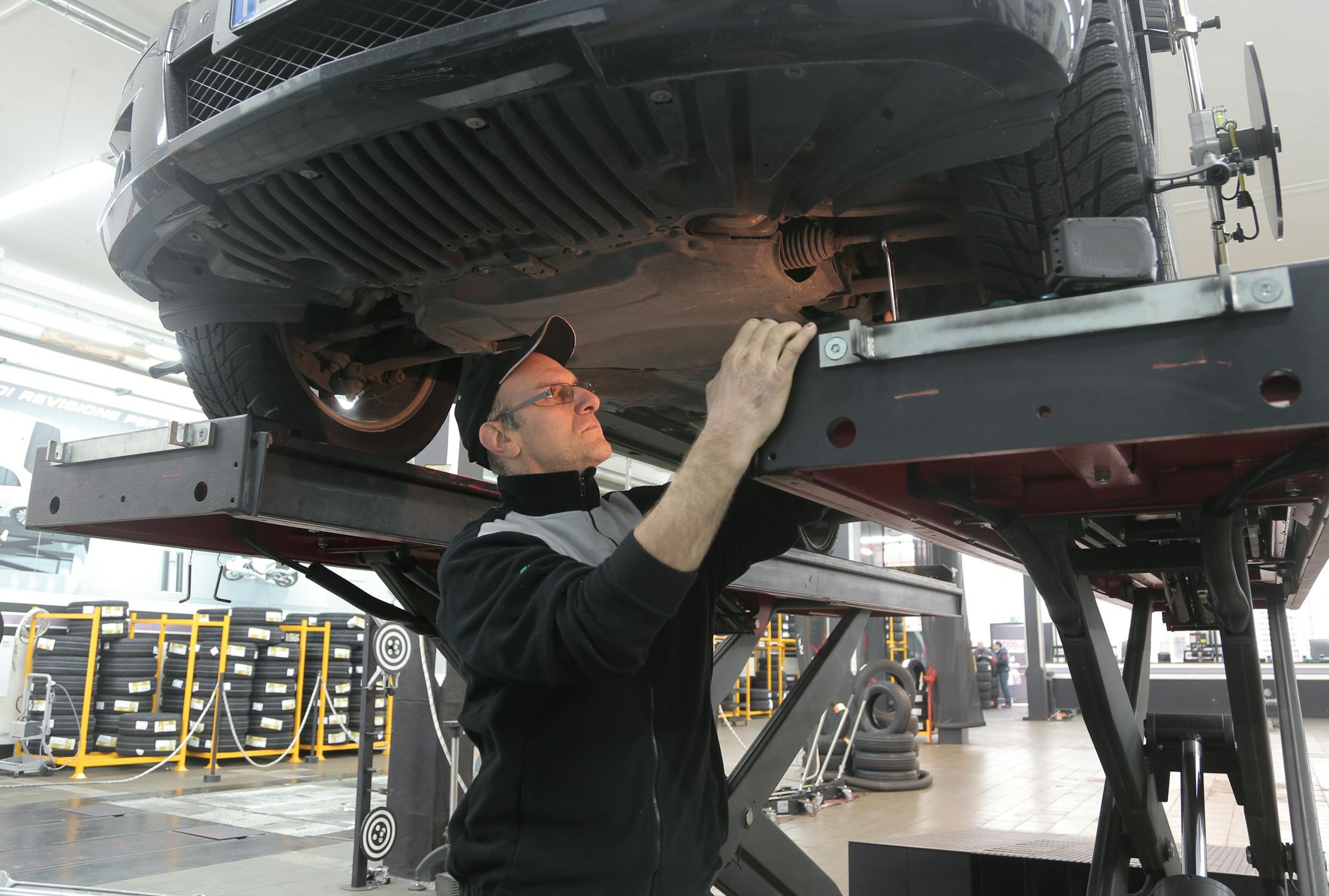 Suspension components visible from under vehicle during inspection in Raleigh